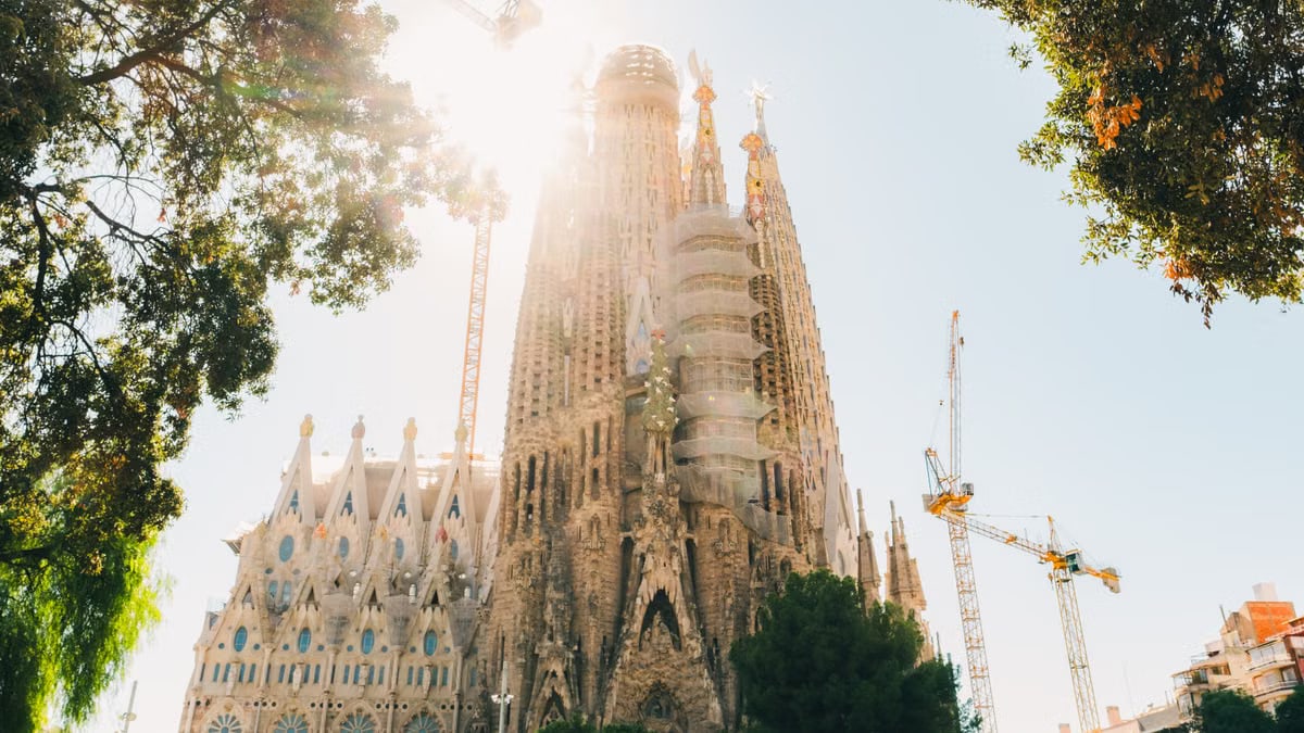 Majestic view of La Sagrada Familia under the bright sun, Barcelona.